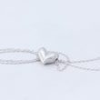 Load image into Gallery viewer, Heart with chain strewn around it, so you can see the marks made whilst carving
