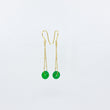 Load image into Gallery viewer, 18ct gold-plated dangle earrings with deep green gemstones on a white background