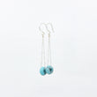 Load image into Gallery viewer, Turquoise gemstone earrings on silver satellite chain, against a white background