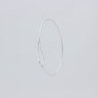 Load image into Gallery viewer, Unusual handmade silver bangle, front view with hook looping into space at bottom of kite-shaped cut out