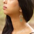 Load image into Gallery viewer, Close up of beautiful silver and copper handmade earrings on model, her hair swept around her neck