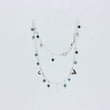 Load image into Gallery viewer, Close up of Tailwind anklet showing intricate chain lined with gemstones and lengths of chain, on white background