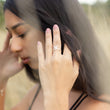 Load image into Gallery viewer, Tailwind made to order silver ring, on a model's hand in close up as she moves her dark long hair