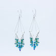 Load image into Gallery viewer, Windcharm dazzling silver handmade earrings, shown in close up and apart from each other on white background