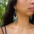 Load image into Gallery viewer, Windcharm handmade sterling silver earrings dangling from model's ears