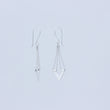 Load image into Gallery viewer, Zephyr silver earrings, one facing forward the other to the side to show profile