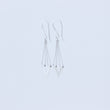 Load image into Gallery viewer, Zephyr earrings sideways view showing chain threaded through tiny tube on top of the V, on white background