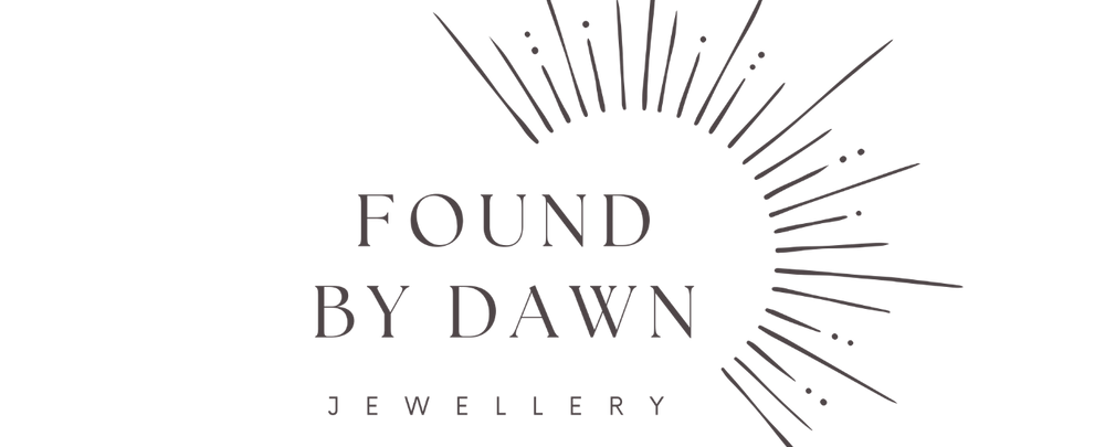 Found by Dawn Jewellery logo in taupe on transparent background, with rays of sunshine spreading upwards and to the right