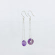 Load image into Gallery viewer, Silver dangle earrings with purple gemstones on a white background
