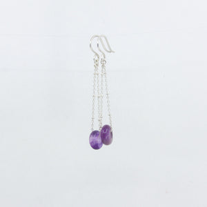 Amethyst gemstones earrings on silver satellite chain, against a white background