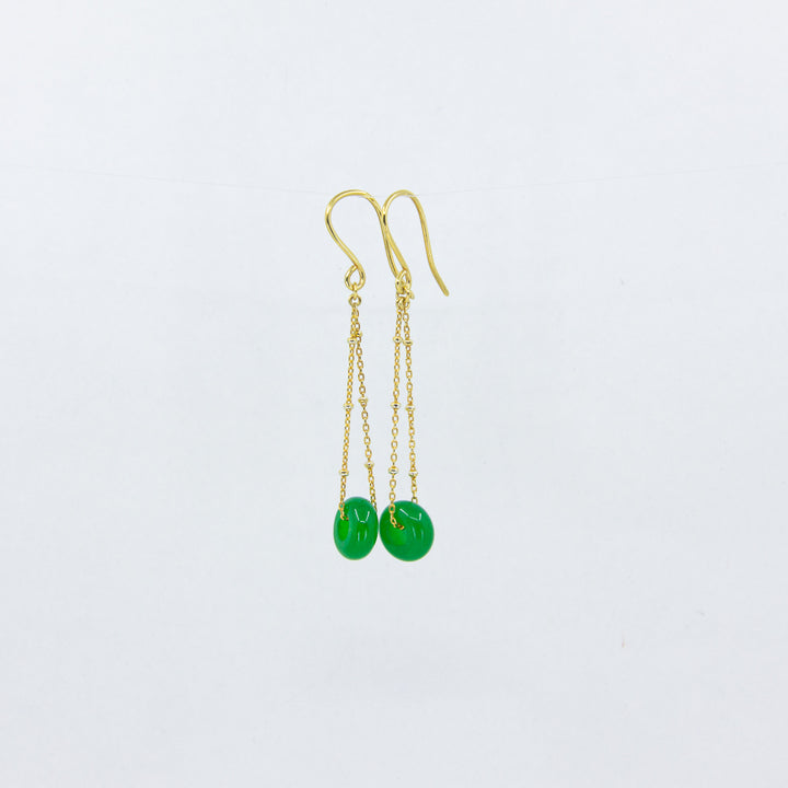 Jade gemstones earrings on gold-plated satellite chain, against a white background