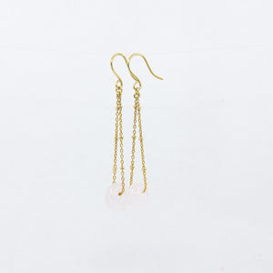 Rose quartz gemstones earrings on gold-plated satellite chain, against a white background