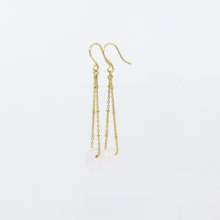 Rose quartz gemstones earrings on gold-plated satellite chain, against a white background