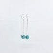 Load image into Gallery viewer, Silver dangle earrings with turquoise gemstones on a white background
