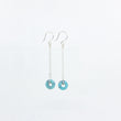 Load image into Gallery viewer, Dangly turquoise gemstone earrings on siver satellite chain, side view on white background
