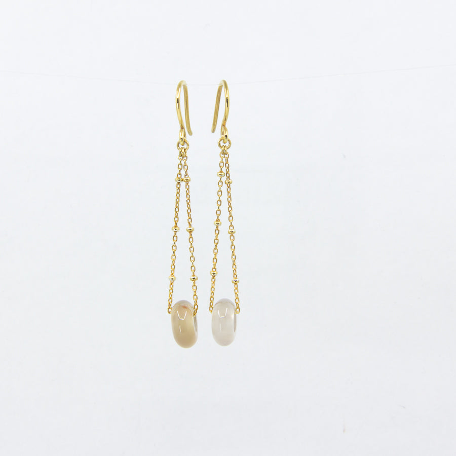 18ct gold-plated dangle earrings with yellow and clear gemstones on a white background