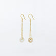 Load image into Gallery viewer, Dangly white agate gemstones earrings on 18ct gold-plated sateliite chain, side view on white background
