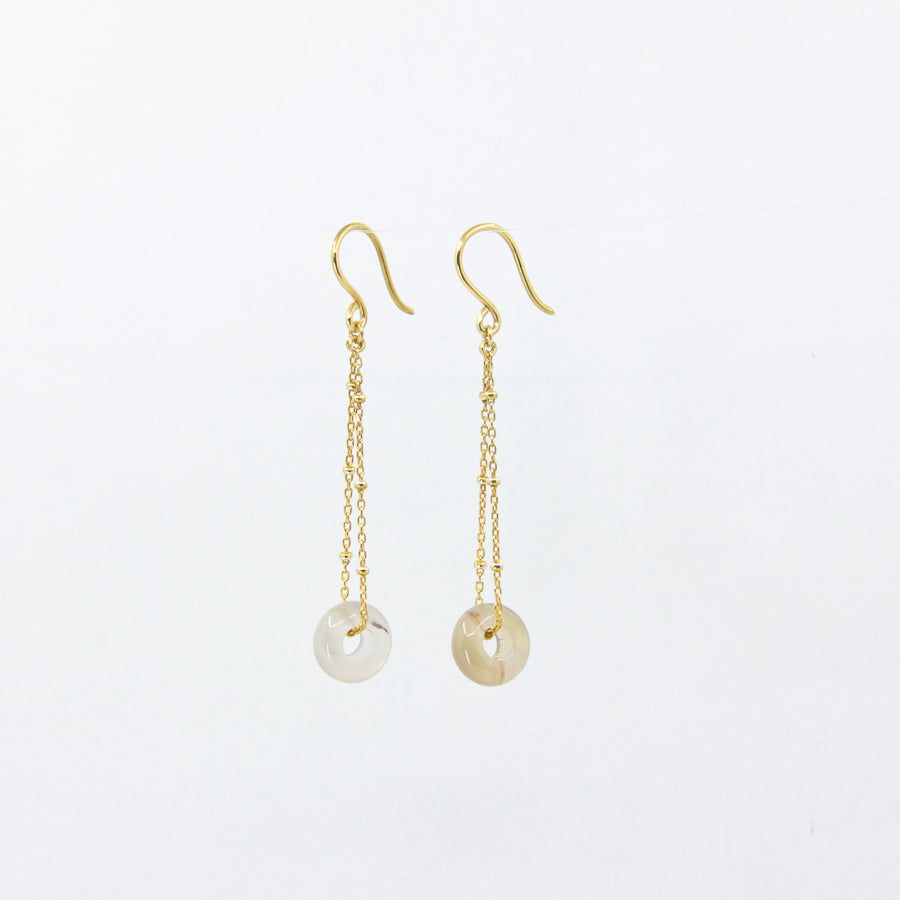 Dangly white agate gemstones earrings on 18ct gold-plated sateliite chain, side view on white background
