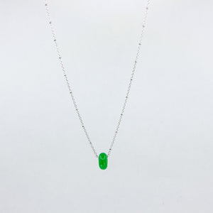 Handmade gemstone necklace with green jade and silver satellite chain, on a white background