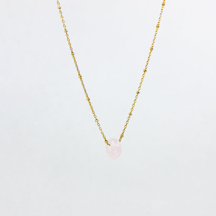 18ct gold-plated necklace with a rose quartz gemstone pendant on white background