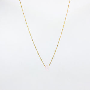 Handmade gemstone necklace with rose and gold-plated satellite chain, on a white background