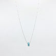 Load image into Gallery viewer, Silver necklace with a turquoise gemstone pendant on a white background
