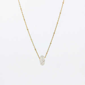 Handmade gemstone necklace with white agate and gold-plated satellite chain, on a white background