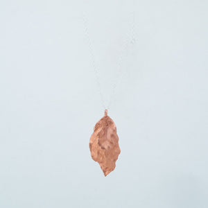 Back view of dangling waving copper leaf
