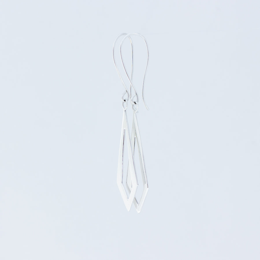 Gorgeous handmade silver earrings, Dancing Kite design from Windblown Collection, close up of the pair placed together with white background