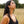 Load image into Gallery viewer, Model wears Spindrift handmade earrings and necklace set, looking up so face is in profile, in field of autumn grass
