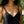 Load image into Gallery viewer, Windcharm necklace from the Windblown Collection with willow trees behind model in V neck black dress
