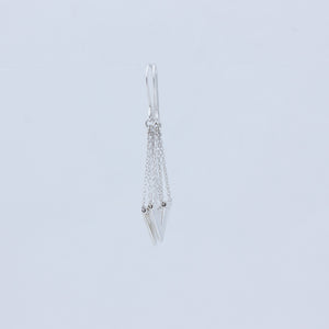 Zephyr earrings in close up from side showing how silver chain threads through tube on top of V-charm