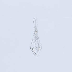 Close up of sterling silver handmade earrings from Windblown Collection